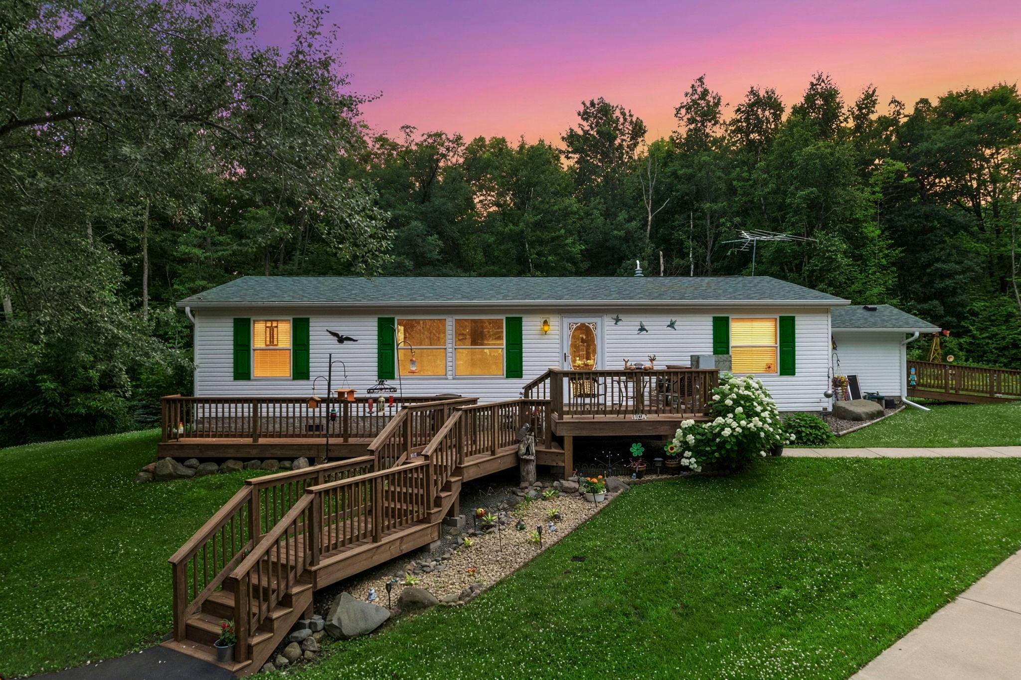 Enjoy Private One Level Living with all the perks! Completely renovated 3 bedroom, 2 bath home tucked away on 7.20 acres conveniently located between St Croix Falls, Balsam Lake & Amery.