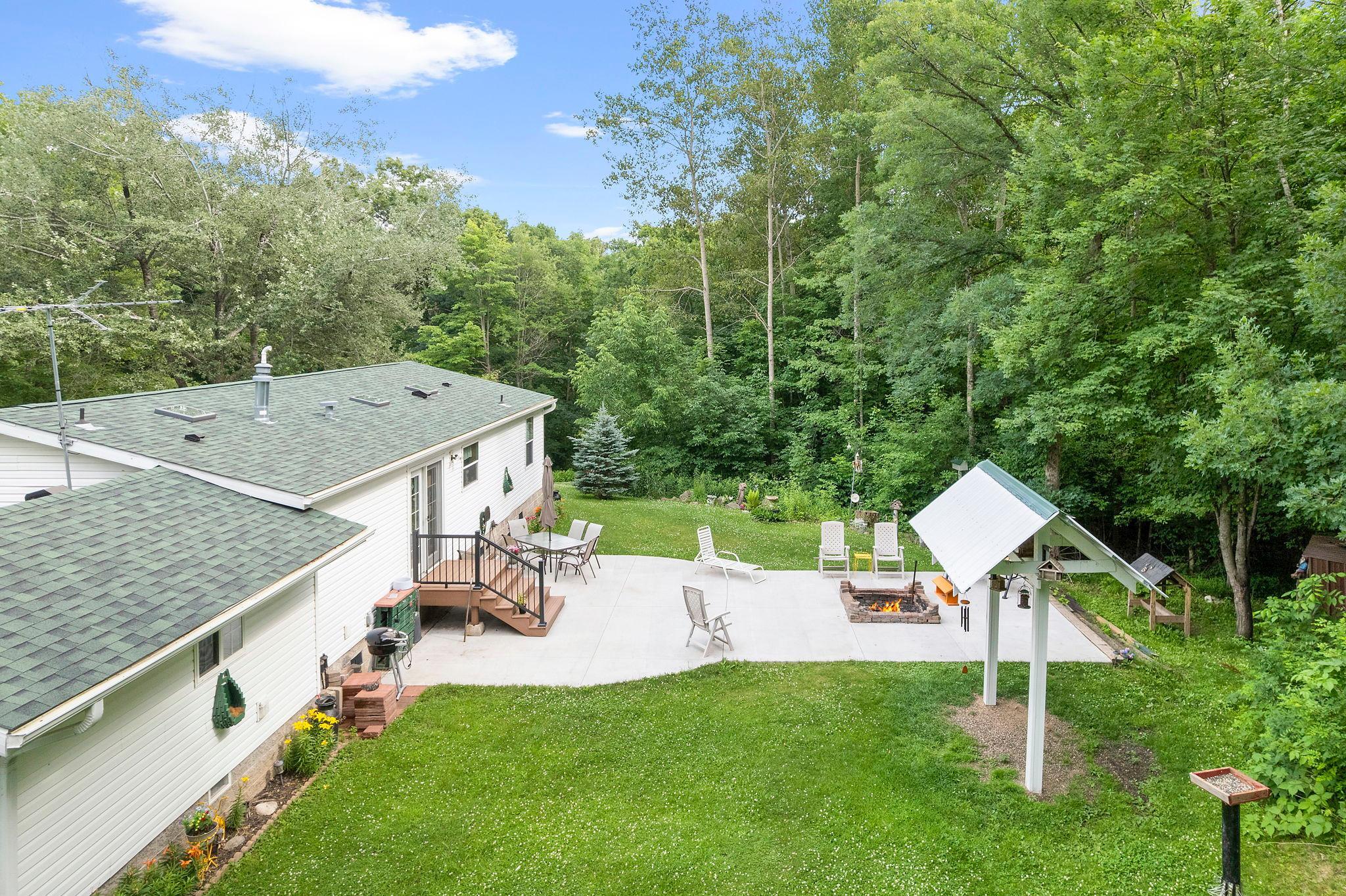 Beautiful back patio just off the dining area. Enjoy a relaxing fire or birds chirping from the birding station.