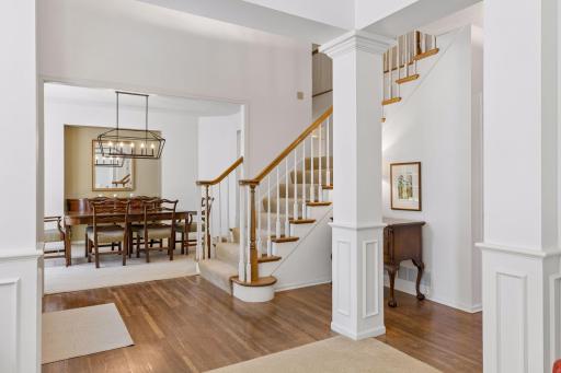 Thoughtfully Connected Spaces. The foyer opens naturally to the formal dining area and main-level living spaces, creating an easy flow throughout the home.