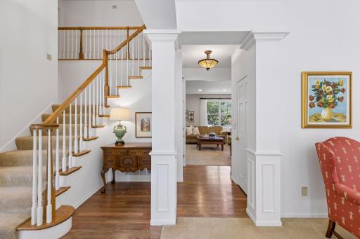 A Grand Welcome. An impressive 18-foot foyer makes a memorable entrance, with refinished hardwood floors and an inviting connection to the home's main living spaces.