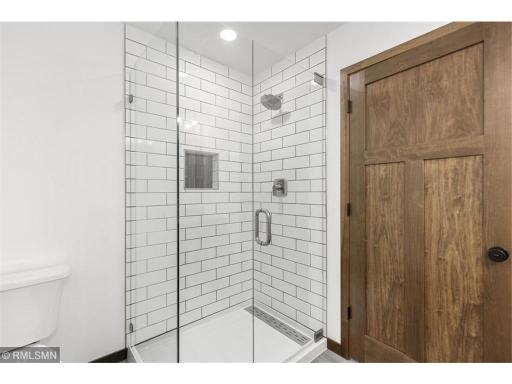 Primary bathroom shower with tiled surround.jpg