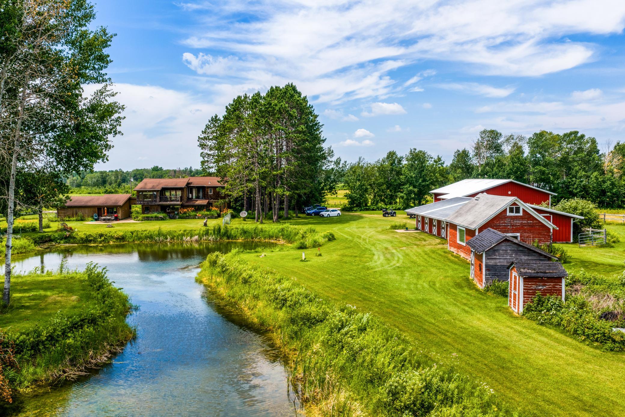 Pond, barn and home back