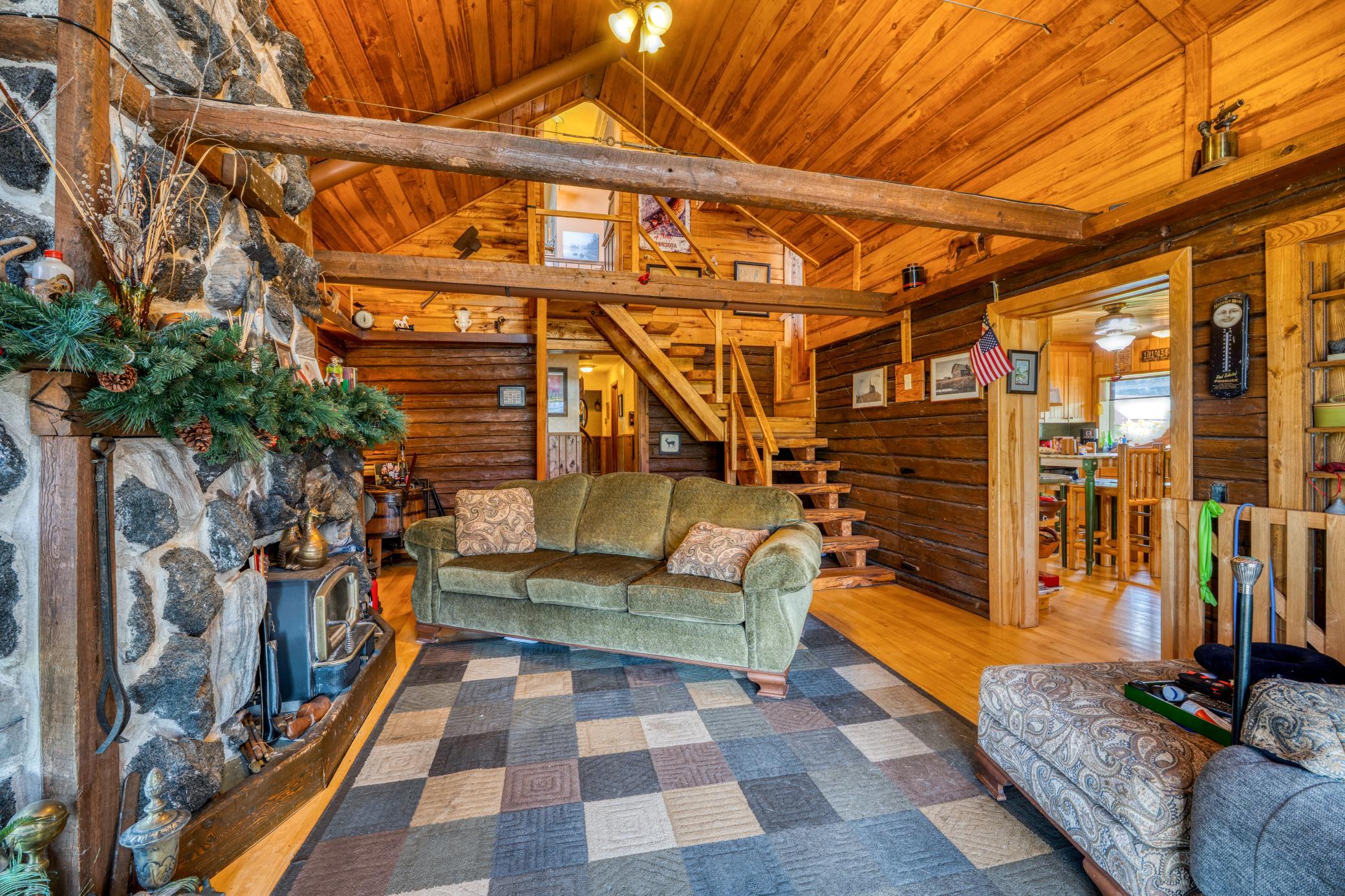 Livingroom stair to owners suite and library
