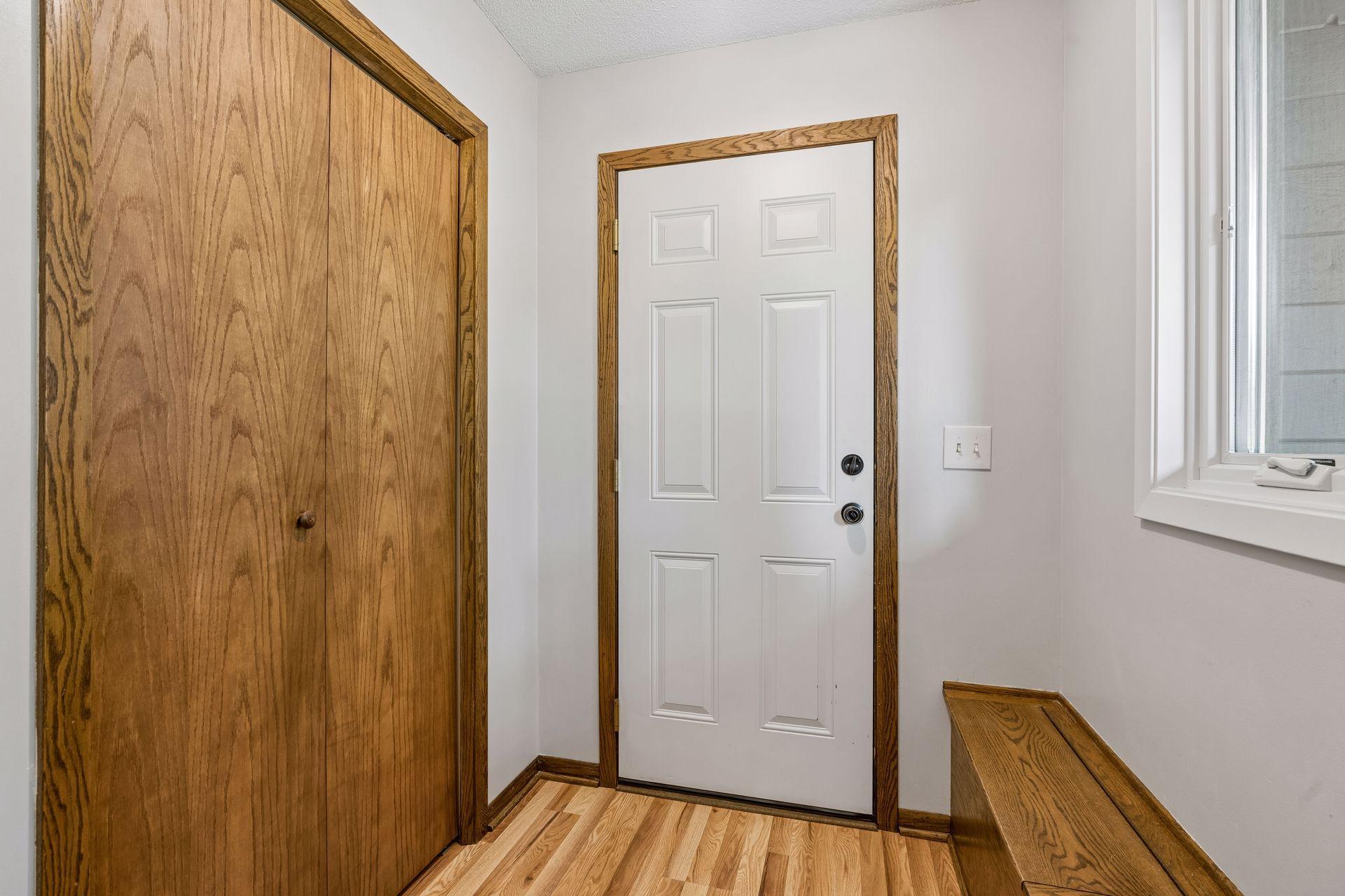 Entry way with closet and bench.