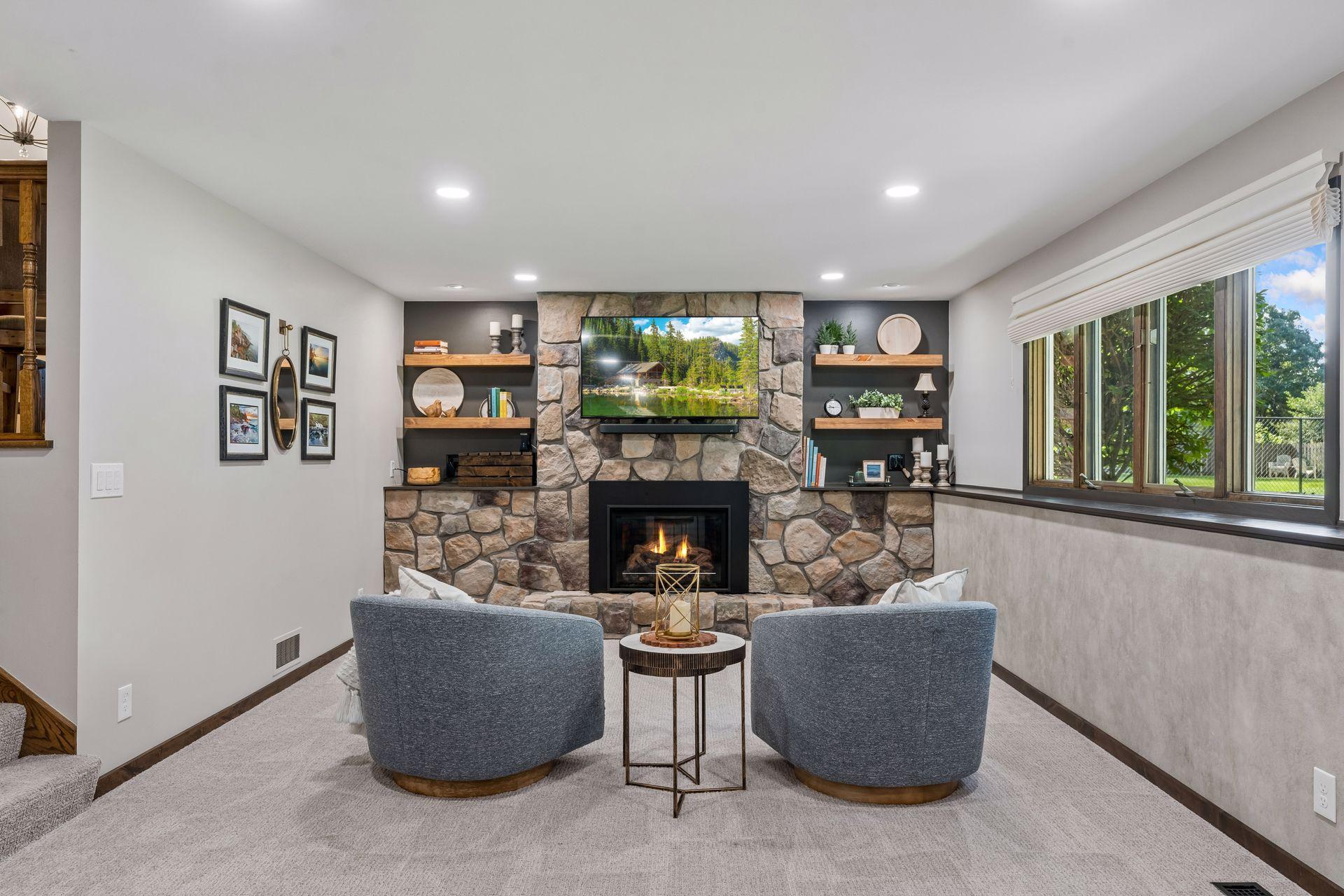 Stunning stone gas fireplace with custom open shelving.