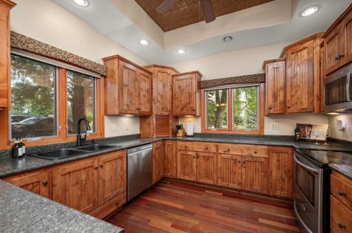 Functional kitchen layout offering generous counter space- a great space for the home chef! Don't miss the copper ceiling tiles- they are gorgeous!