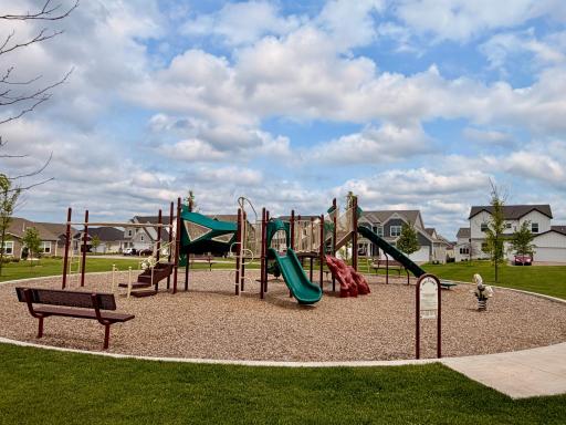 Multiple neighborhood playgrounds create spaces for play, connection, and community.