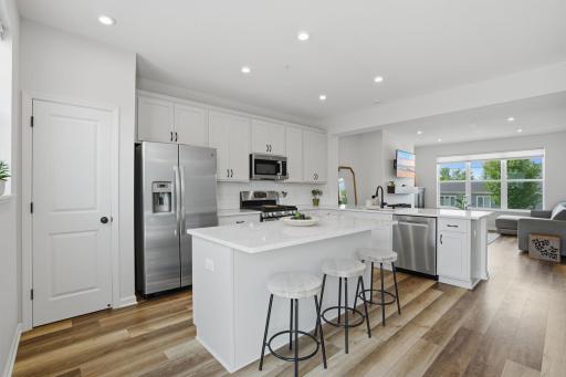 Enjoy casual mornings at the oversized island or memorable dinners in the adjacent dining space.