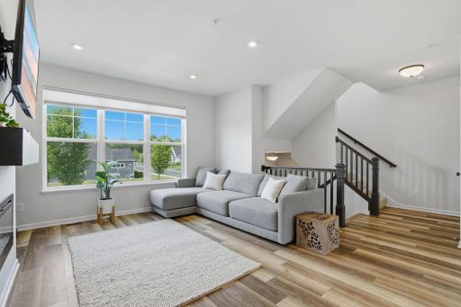 Natural light pours in through expansive windows, creating a bright and peaceful atmosphere throughout the home.