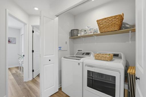Convenient upper-level laundry keeps everyday living simple and efficient.