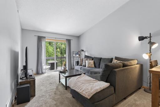 Patio door to your private deck brings in lots of natural lighting!