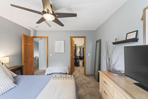 Upstairs primary bedroom with walk in closet and a view of the backyard!