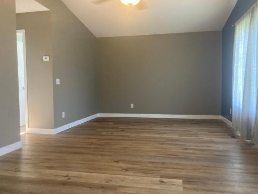 upper level living room with vaulted ceiling
