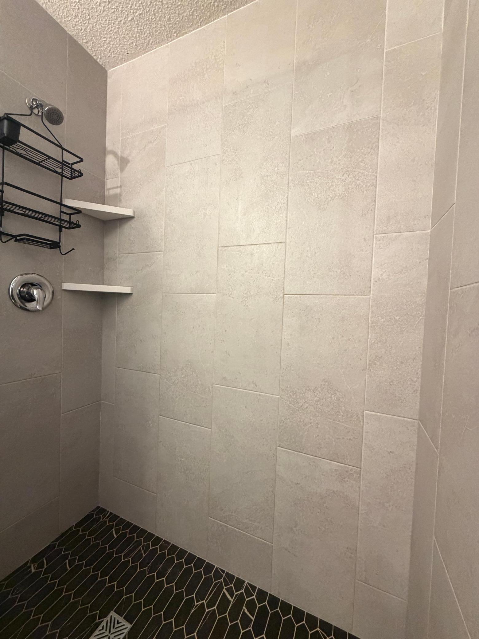 custome tiled shower with glass doors