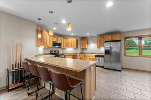 Lowe level full kitchen says, "I'll host the Superbowl!"