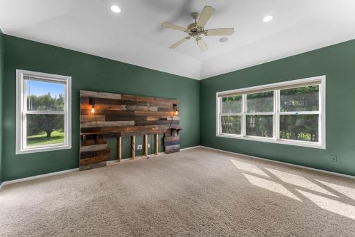 Primary bedroom where it shines with a custom-built headboard.