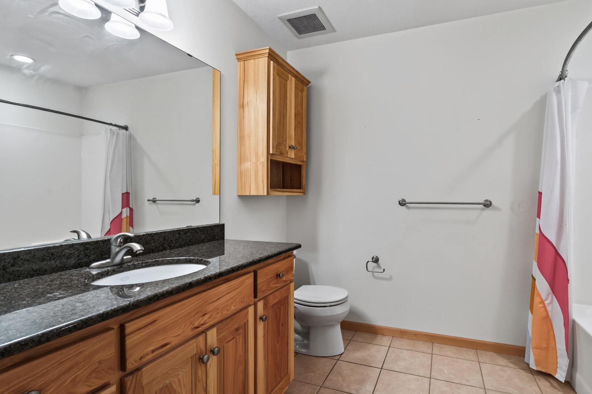 Deep Linen Closet behind door in Upper Full Bathroom