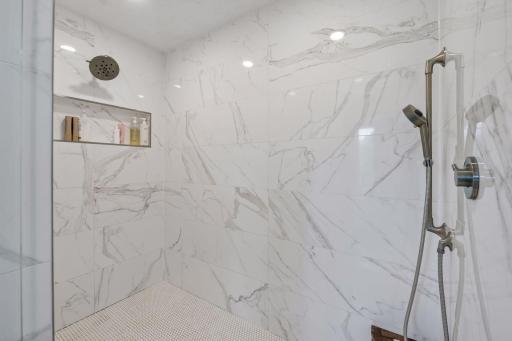 Primary bedroom oversized walk-in shower with dual shower heads