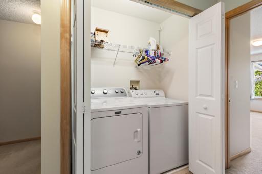 A conveniently placed upper level laundry closet.