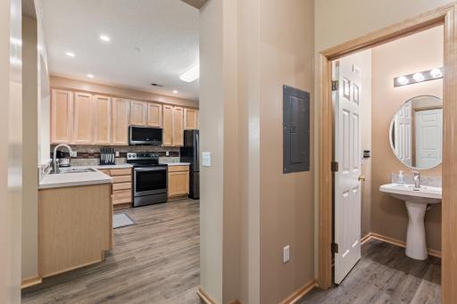 Landing area atop the garage entry, looking towards the kitchen & main level half bathroom.