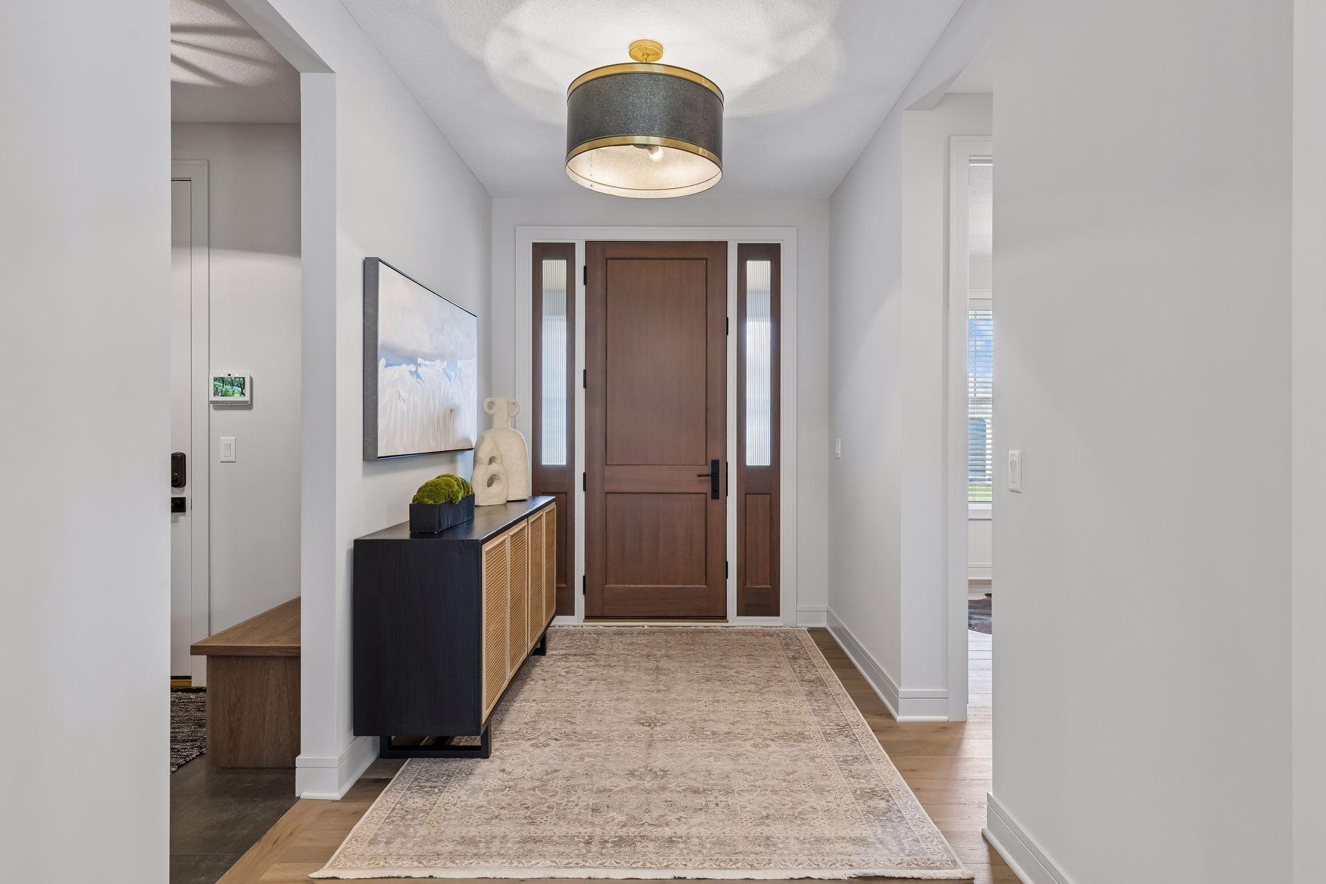 9' front door with transom windows.