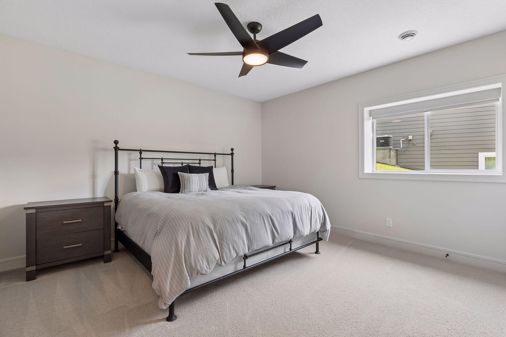 Lower-level bedroom #1 with lookout windows and large closet.