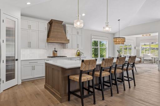 Large kitchen island with square panel detailing.
