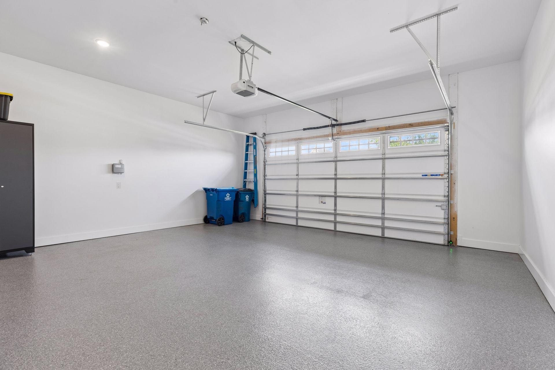 The garage really is THIS CLEAN. The seamless polyaspartic floor coating is spotless.