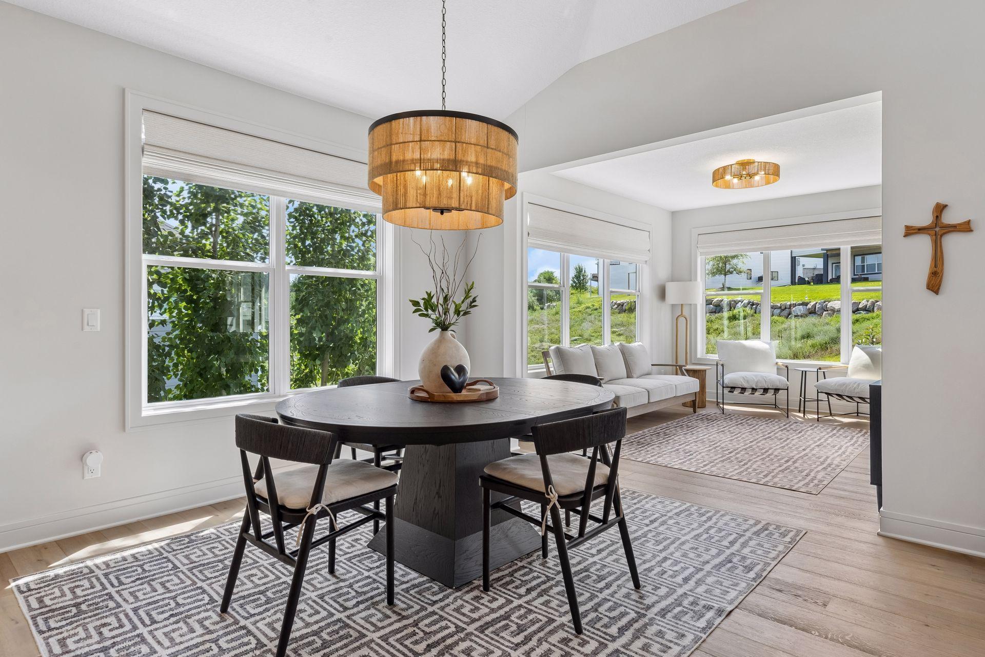 Spacious dinette featuring designer lighting, one of many high-end fixtures showcased throughout the home.
