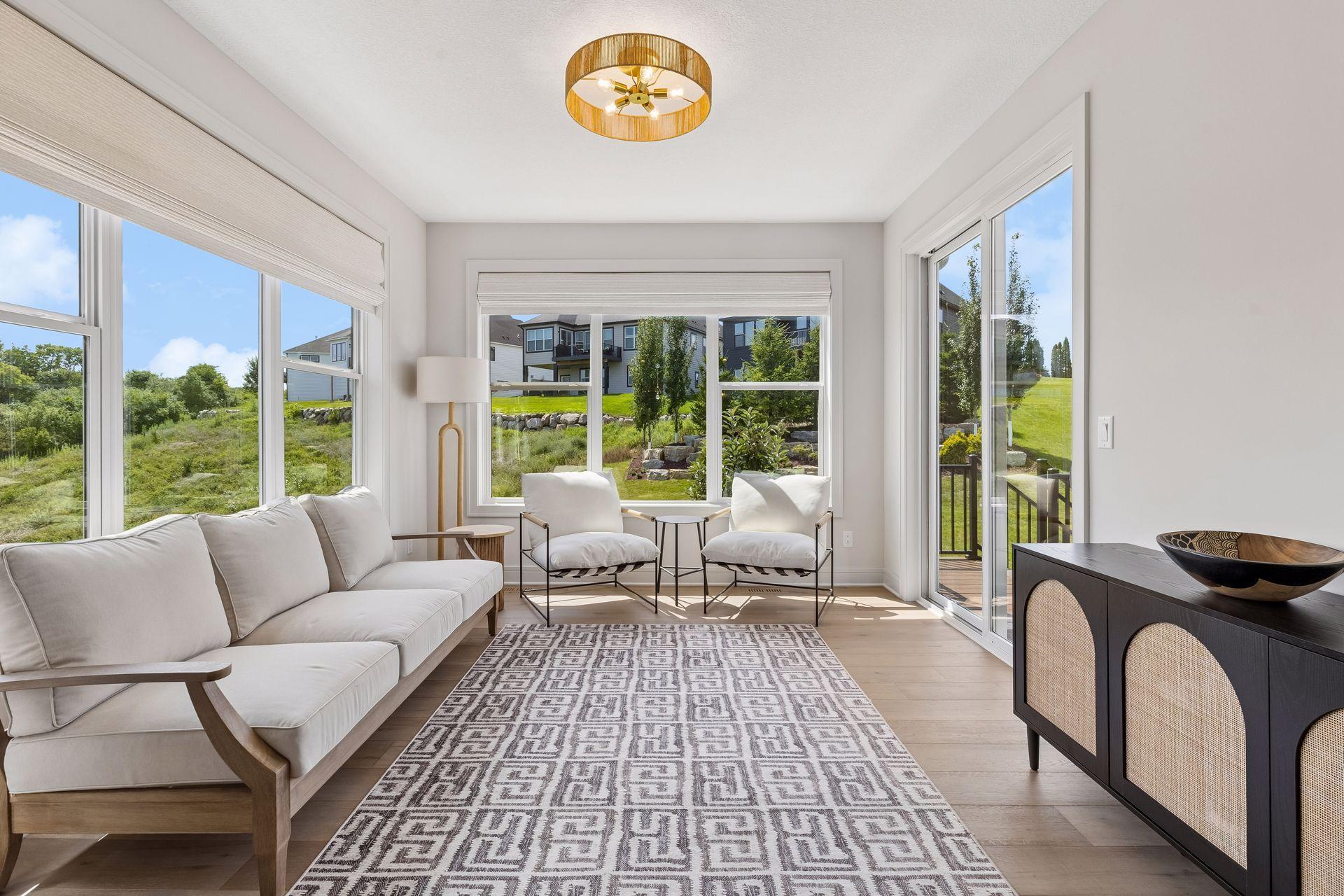 Sliding glass door provides direct access to the maintenance-free deck, perfect for seamless indoor-outdoor living.