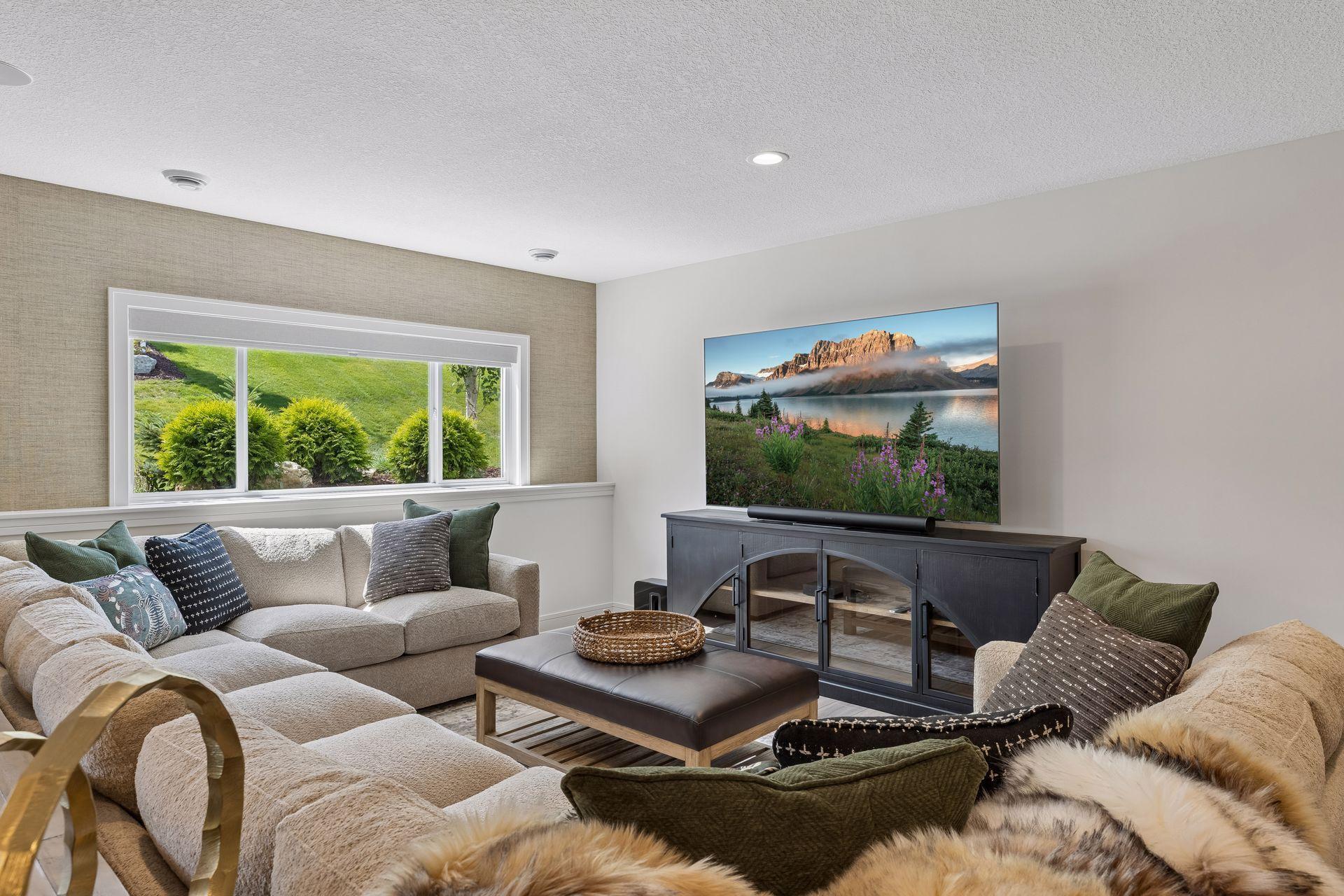 9' lower level ceiling height. The home is wired for speakers in the main living room and lower level family room spaces. Both areas also have ethernet television connections.