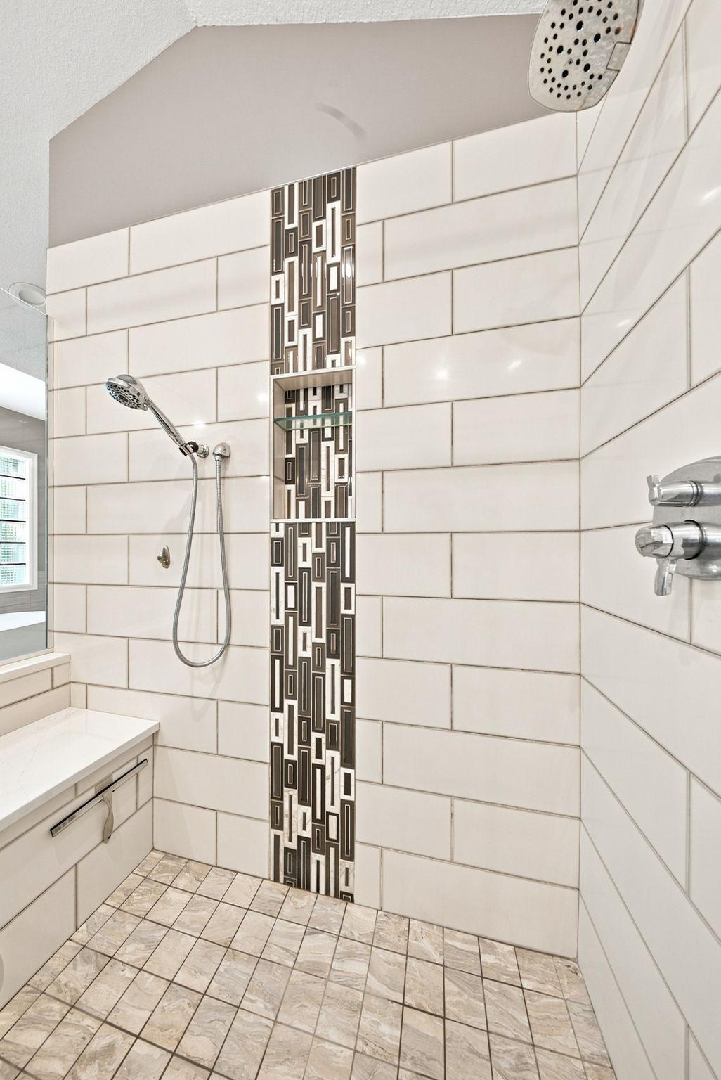 Beautiful tile design and a bench in the primary bath shower