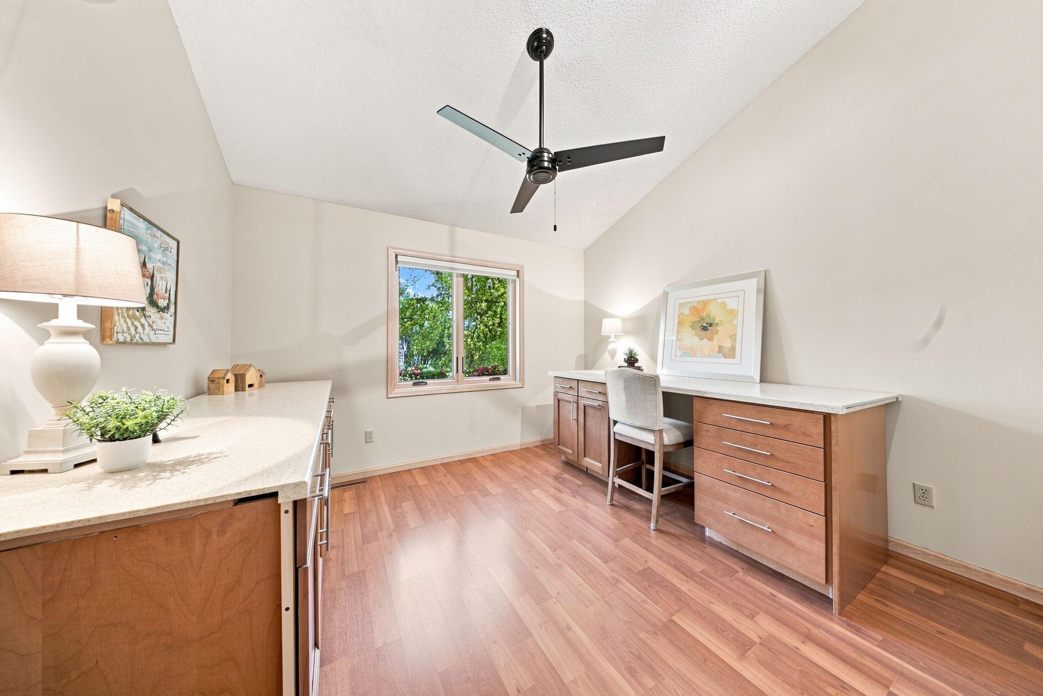 Bedroom 3 boasts a vaulted ceiling and a custom closet.