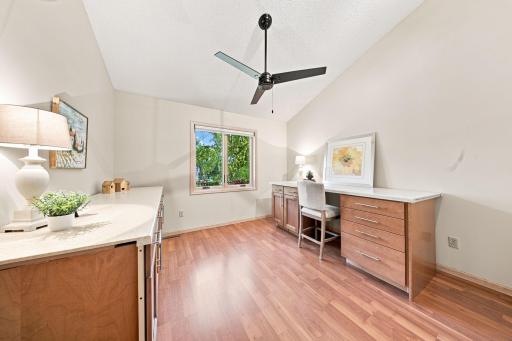 Bedroom 3 boasts a vaulted ceiling and a custom closet.