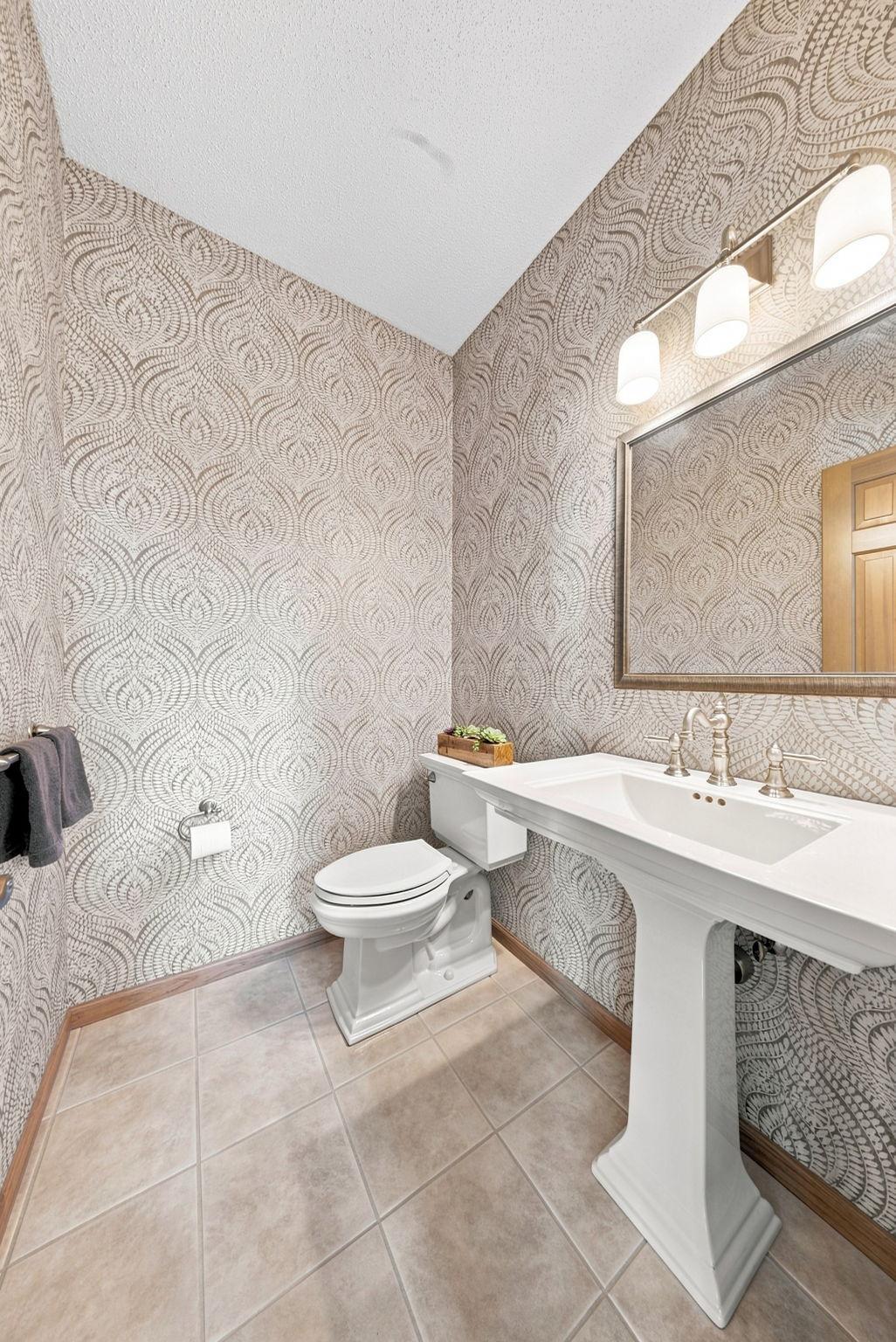 Such a pretty half bath on the main level
