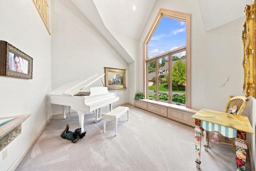 Large windows and unique ceilings in the formal living room