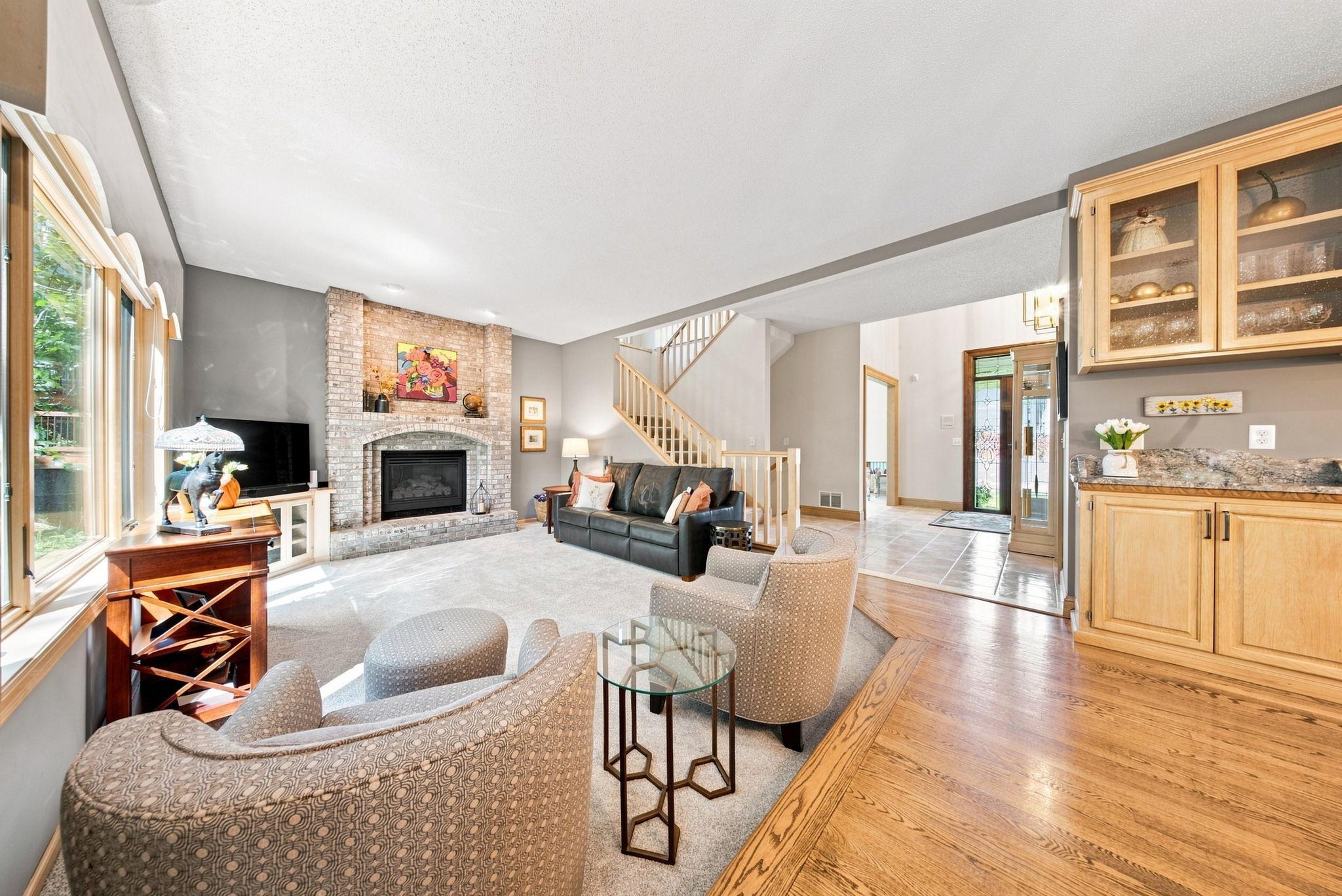 A beautiful brick gas fireplace in the family room