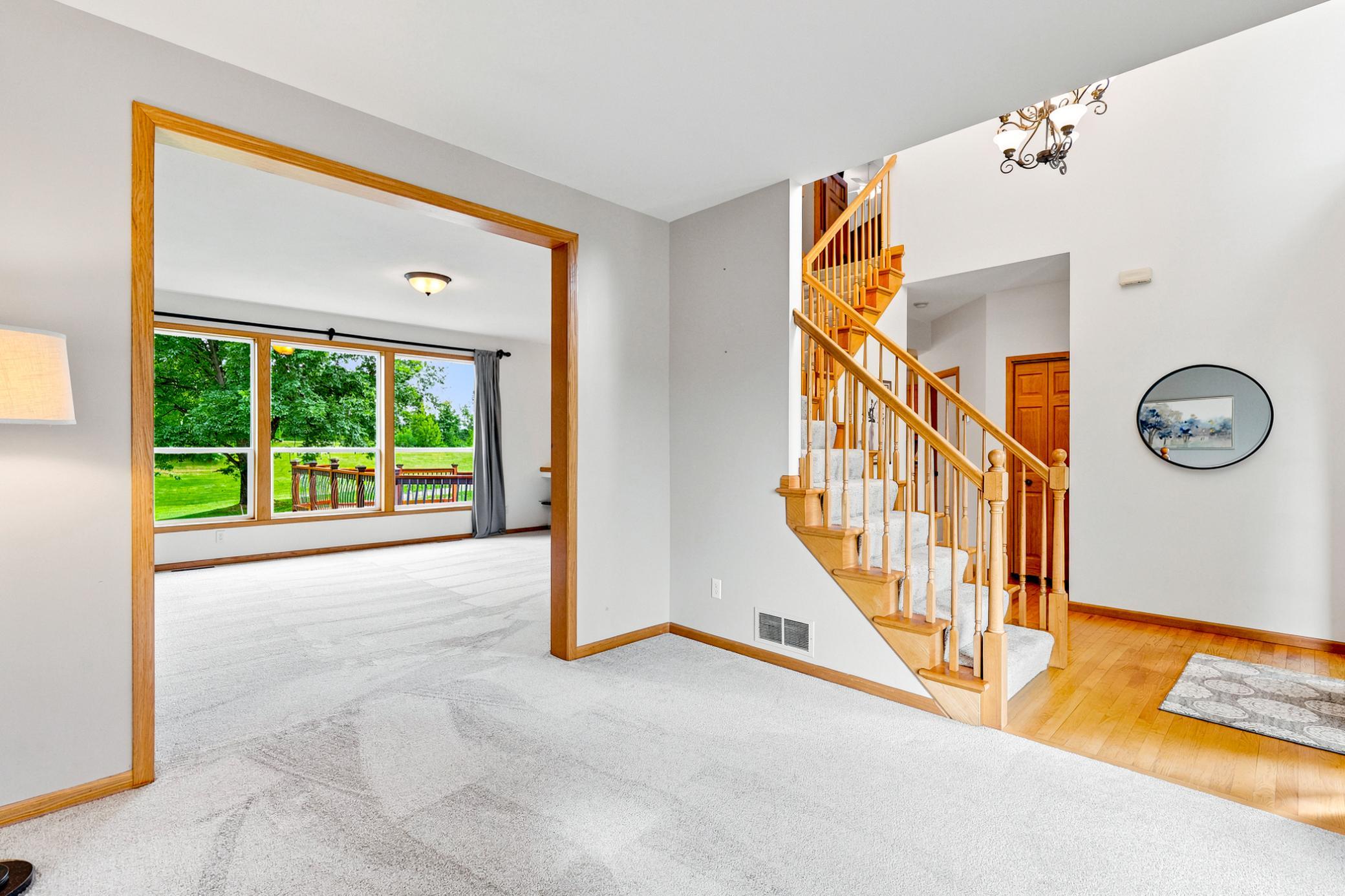 The thoughtfully designed main level offers exceptional flow, seamlessly connecting the grand foyer, inviting great room, and open living spaces for effortless entertaining.
