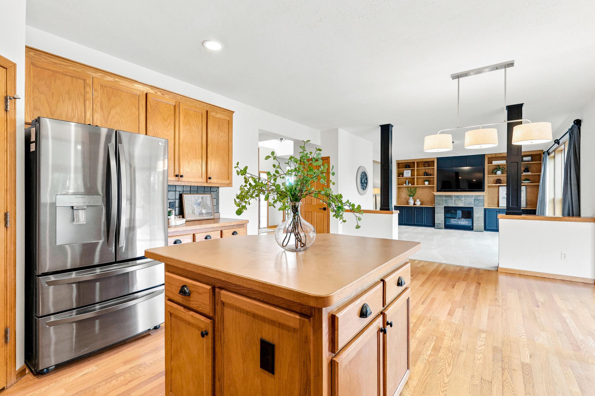 Designed with today's lifestyle in mind, the open-concept kitchen flows seamlessly into the great room, creating a warm and inviting space with exceptional views of the golf course beyond.