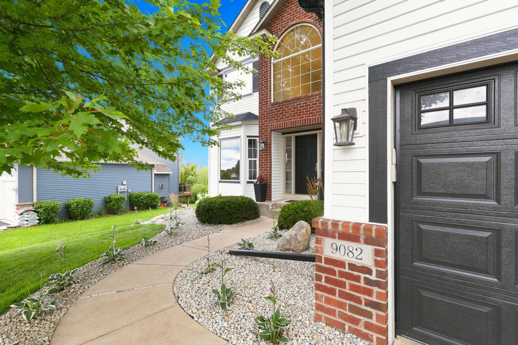 Classic two-story architecture with timeless brick accents, a spacious 3-car garage, mature shade trees, and beautifully maintained landscaping showcase the pride of ownership found throughout this exceptional home.