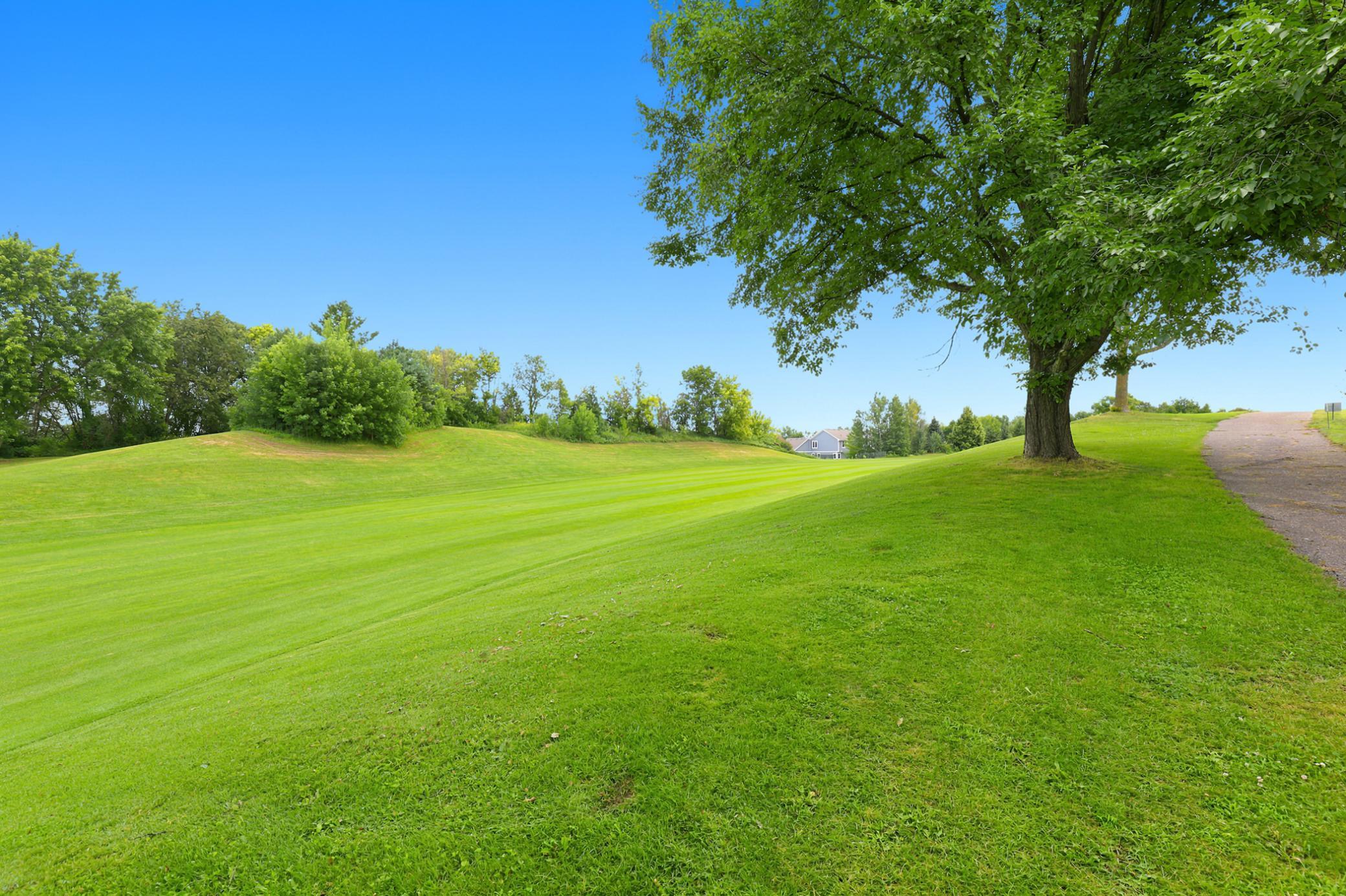 Your backyard extends to sweeping fairway views, offering a peaceful setting with lush greens, mature trees, and direct access to the beauty of Boulder Pointe Golf Course.