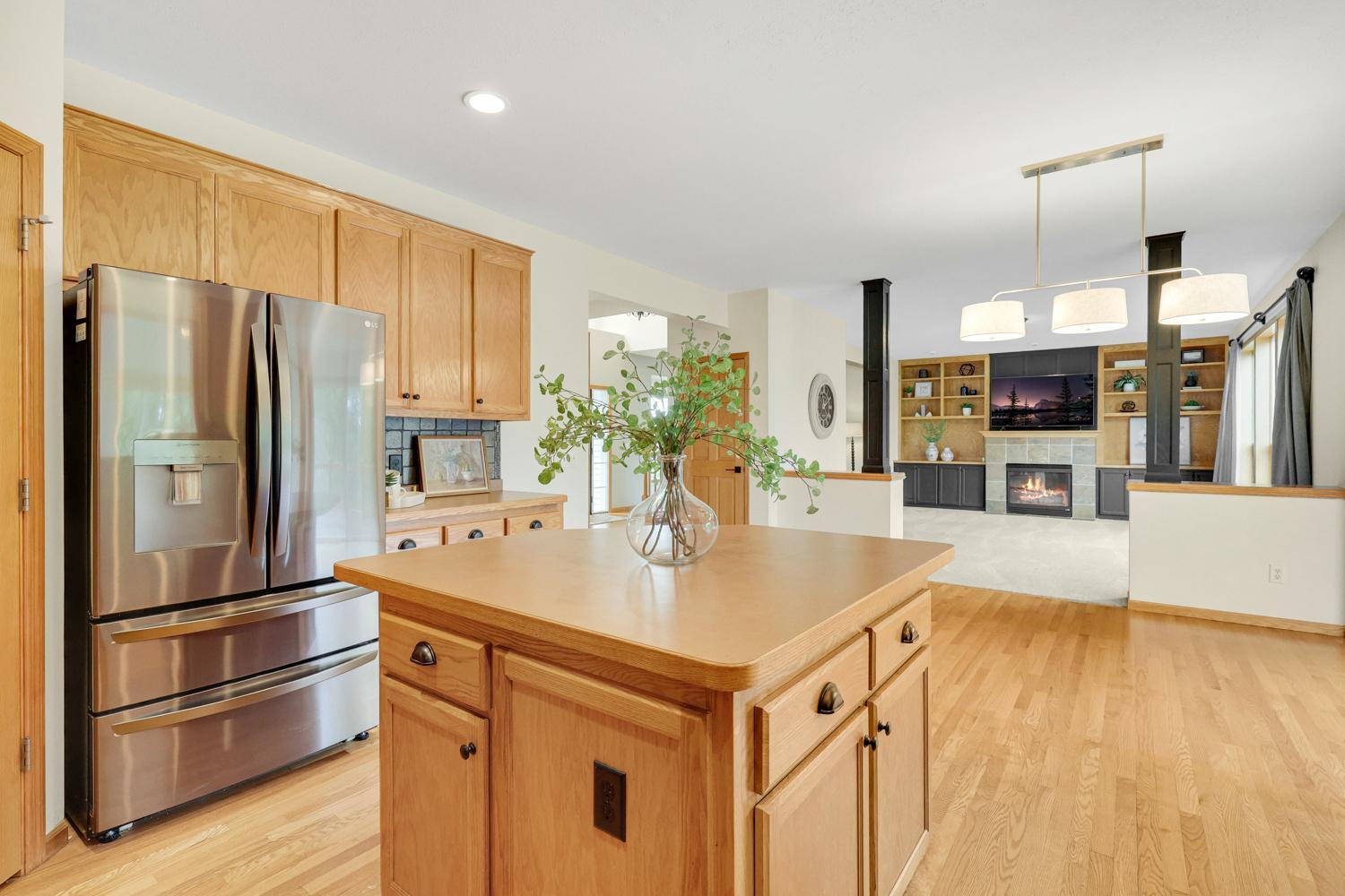 Designed with today's lifestyle in mind, the open-concept kitchen flows seamlessly into the great room, creating a warm and inviting space with exceptional views of the golf course beyond.
