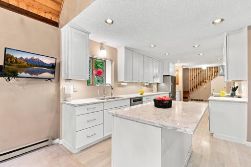Updated kitchen with granite countertops.