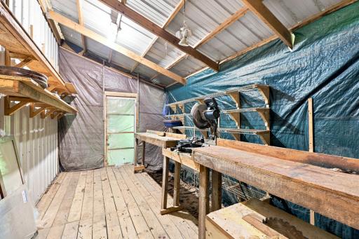 workshop, not insulated. Door leads to storage area.,