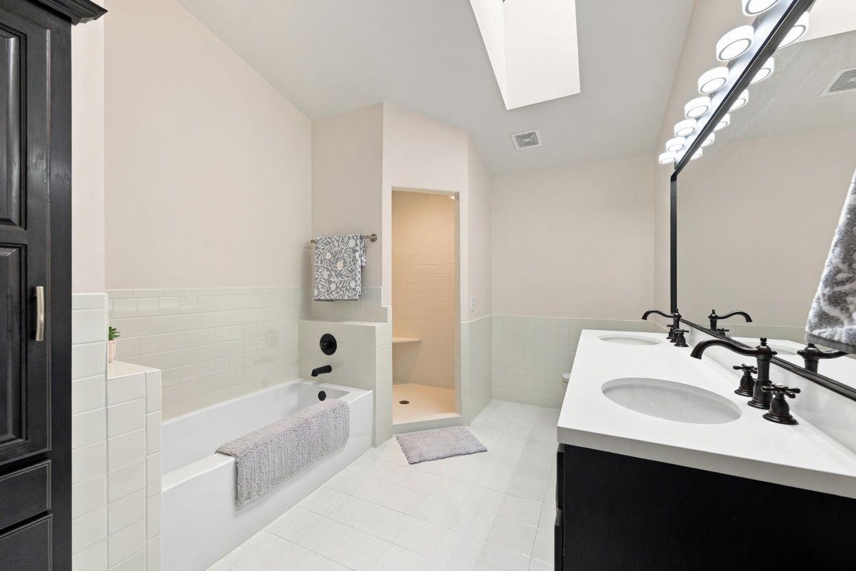 The large private, primary bath features separate soaker tub and shower!