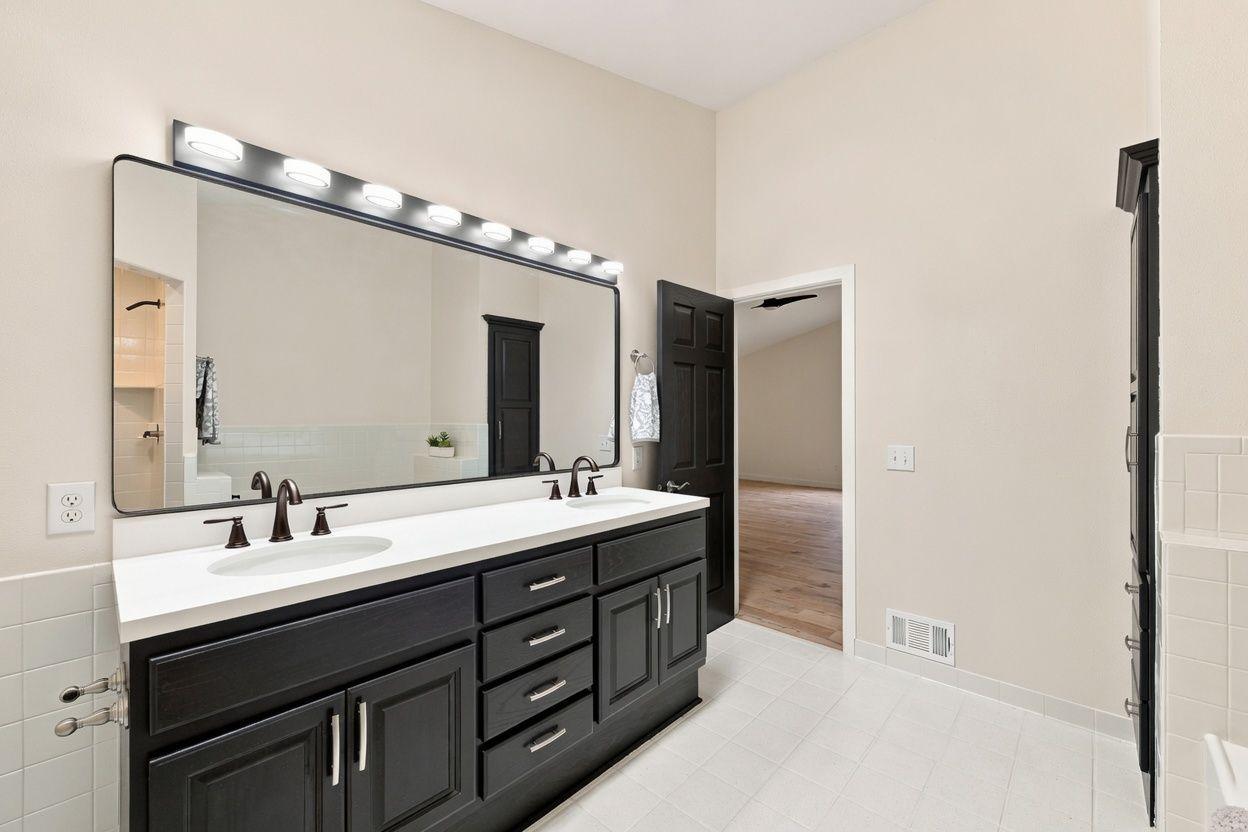 Wonderful raised double vanity with plenty of drawers and cabinet space!
