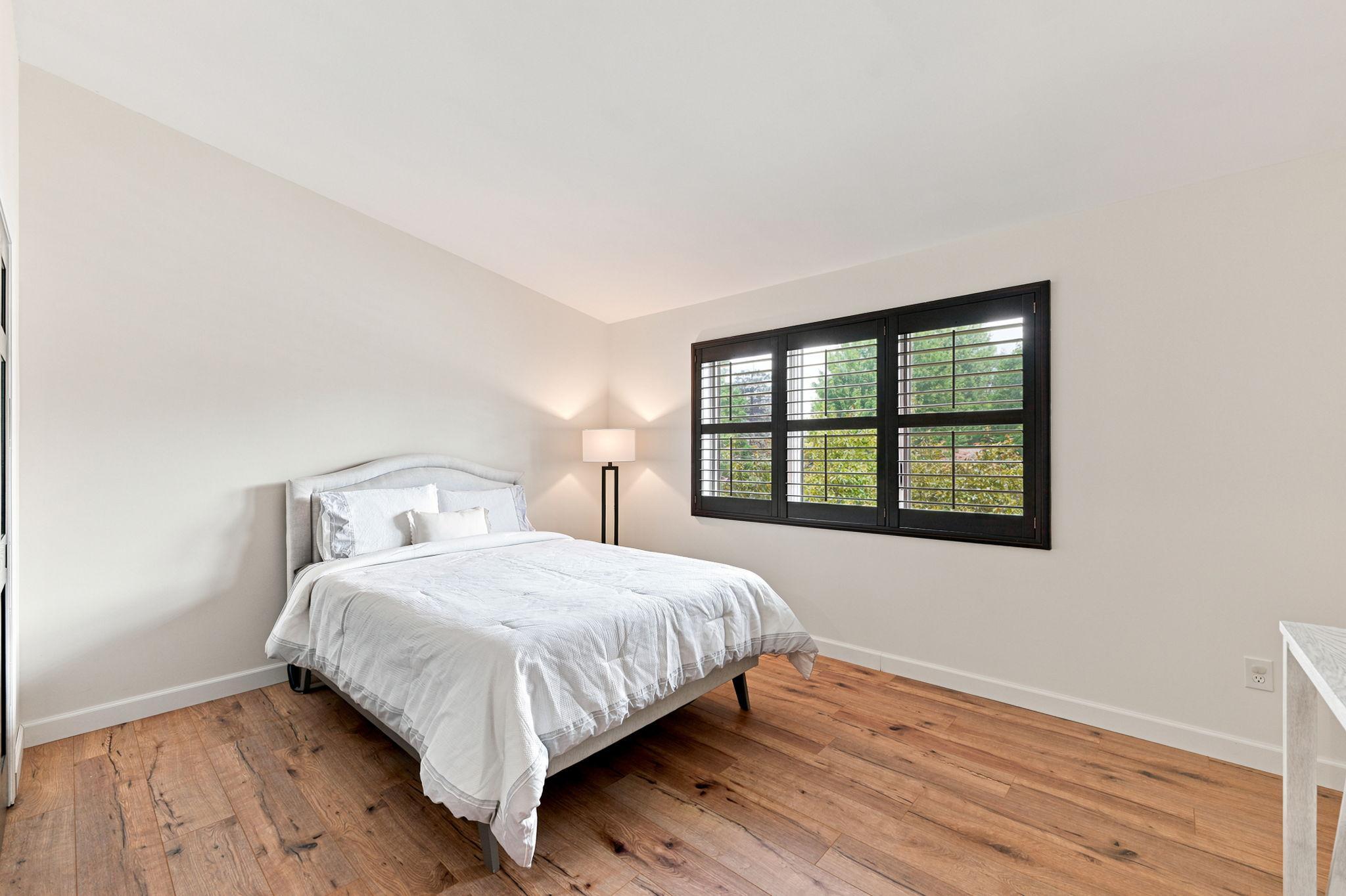 The guest room features a large shuttered window and vaulted ceiling!