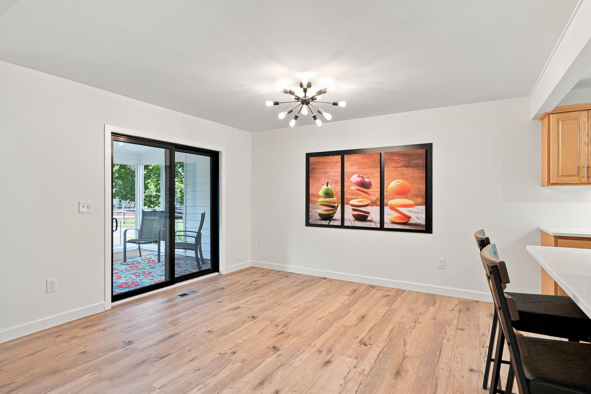 The formal dining area walks out to the screened in porch!
