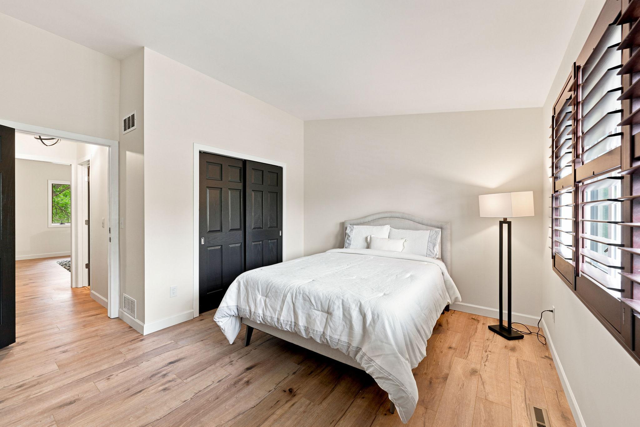 The 11 x 14 upper level guest bedroom includes a large closet and a convenient, adjacent bath!