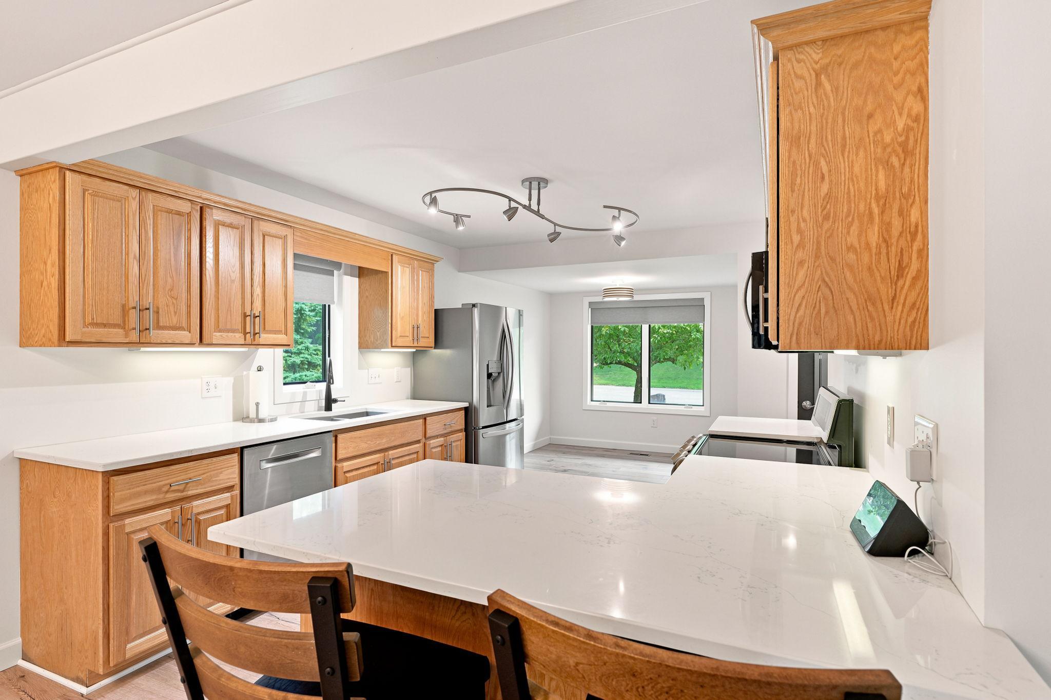 The kitchen also features a large breakfast bar!